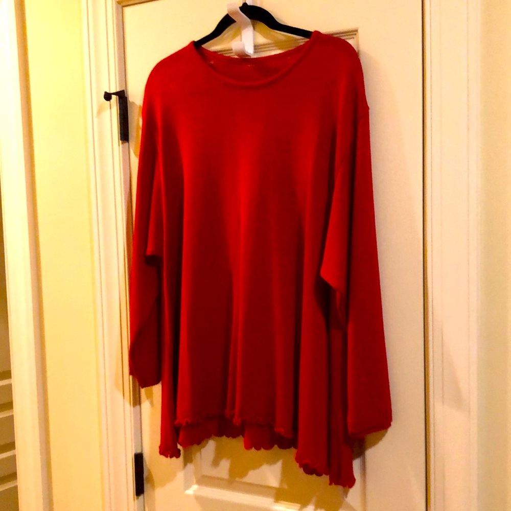 Red knit sweater. Tunic style with curly hem